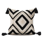coussin décoratif boho chic blanc bleu marron beige doré motifs géométriques pompons coton