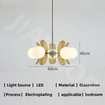 suspension lumineuse moderne sphères translucides métal doré salon chambre salle manger