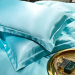 protège oreiller soie uni moderne beige gris rose vert violet bleu opulent brillant 48x74cm