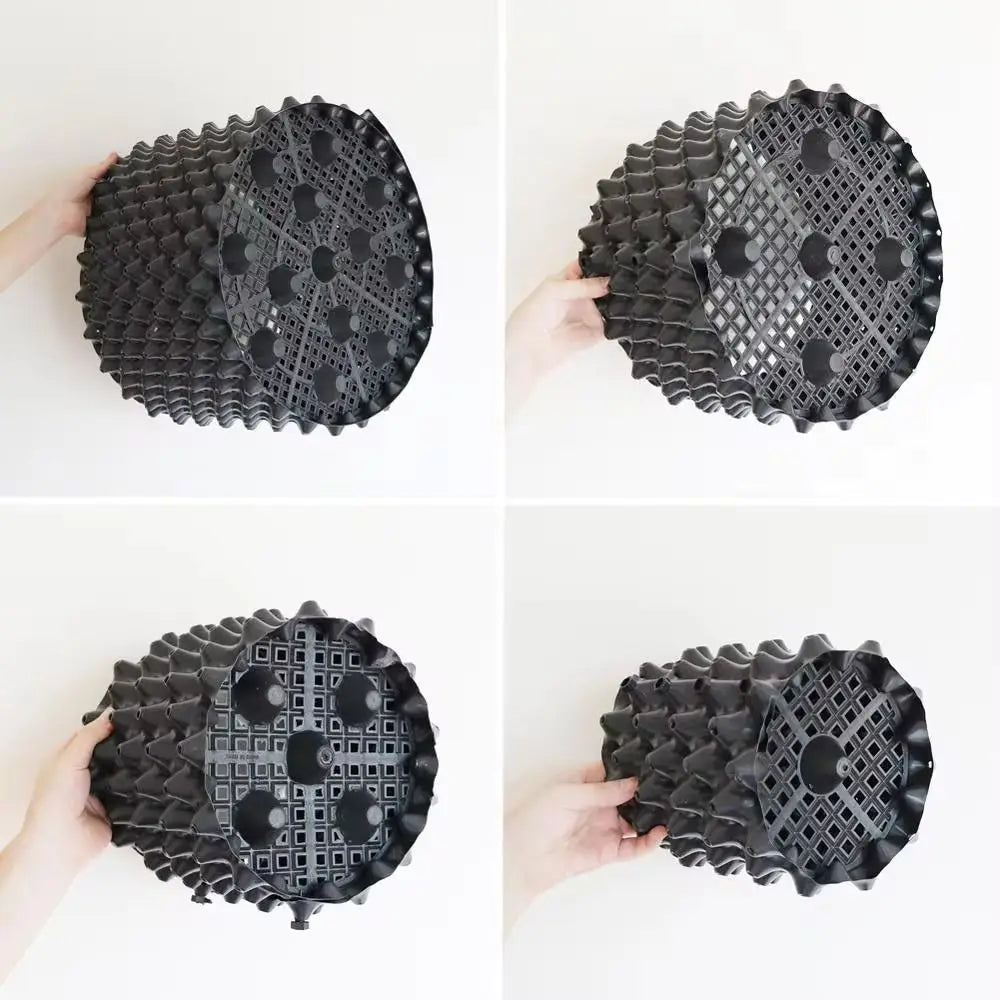 grille drainage plante noir moderne perforations circulaires différentes tailles incluses