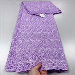tissu dentelle coton blanc motifs floraux broderie strass robe couture luxe