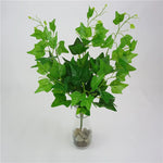 plantes artificielles violet vert marron feuilles ovales moderne décoration extérieure vase galets noirs blancs