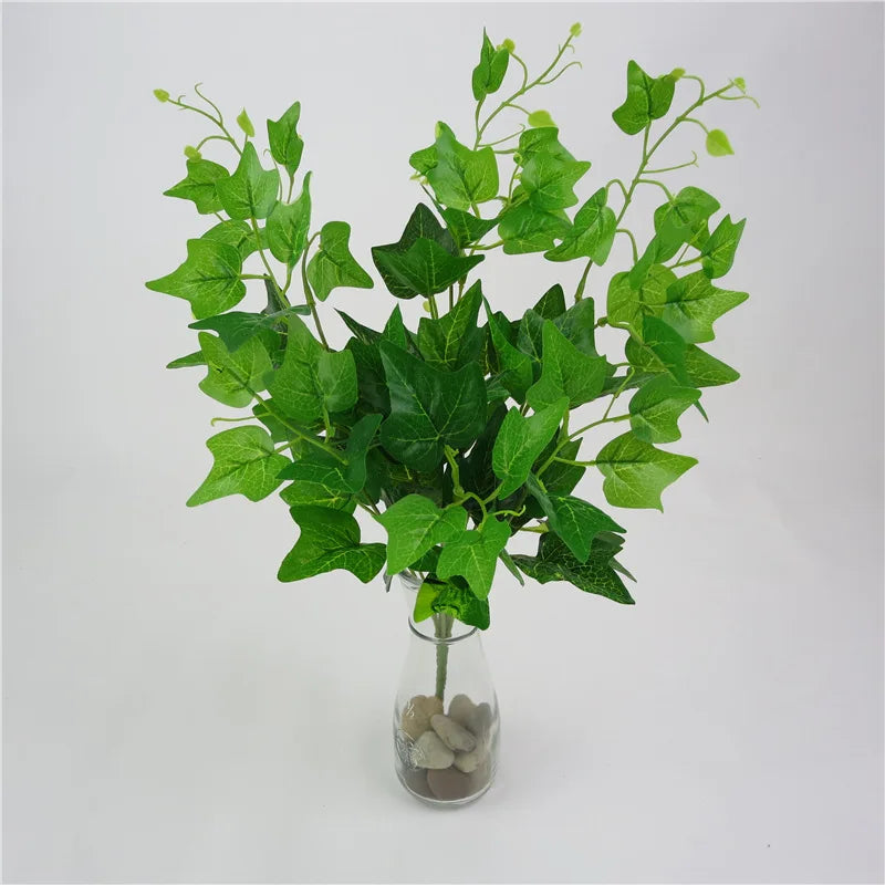 plantes artificielles violet vert marron feuilles ovales moderne décoration extérieure vase galets noirs blancs