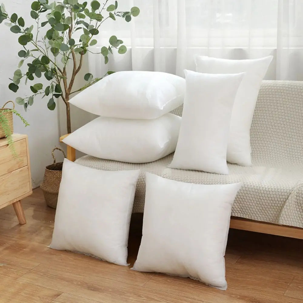 coussins blancs mousse mémoire forme rectangulaire literie adulte texture lisse minimaliste