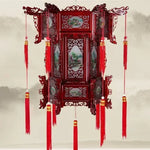 lanterne traditionnelle chinoise bois sculpté rouge décorative pompon fête mariage jardin