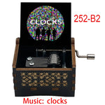 boîte musicale bois naturel motifs floraux 18 tons vintage manivelle horlogerie artisanale