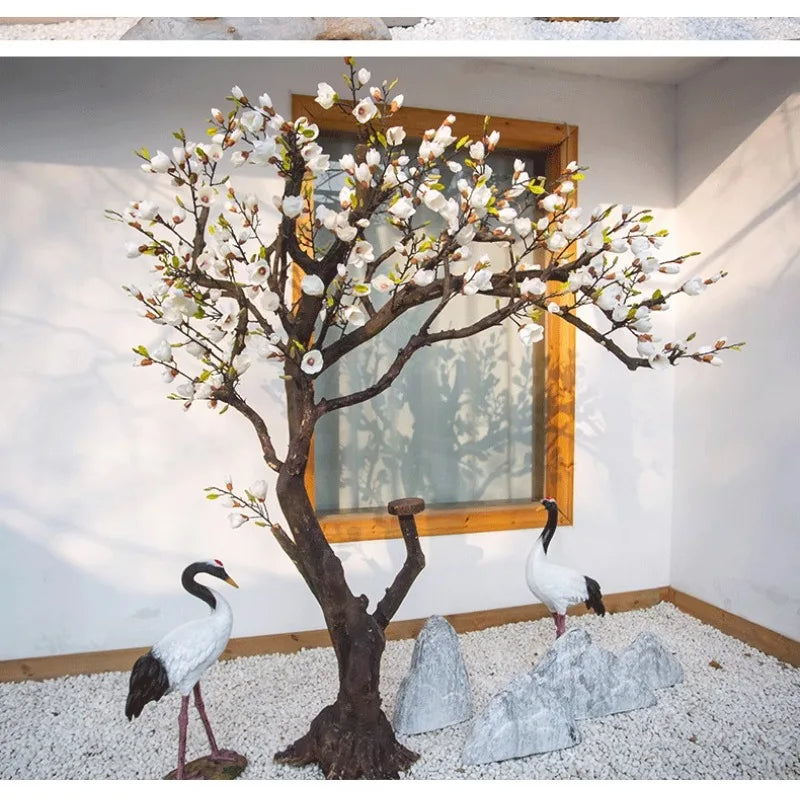 arbre artificiel magnolia fleurs blanches feuilles vertes tronc brun oiseaux rochers decoration exterieure decoration