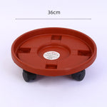 support roulettes pot fleurs orange moderne roues transparentes