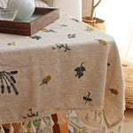 nappe coton brodée fleurs verte jaune violette rustique serviettes assorties tissage uni opaque salon