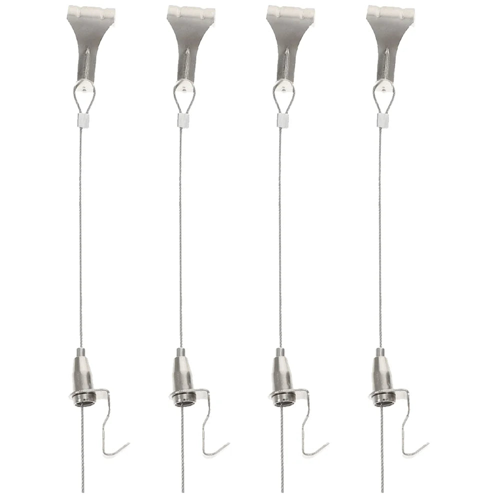 câbles métalliques fins suspension tableaux cadre bois clair crochets métal argenté tableaux encadrés paysages