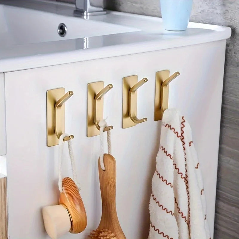 porte serviettes adhésifs dorés modernes serviette blanche brosse gant toiletierie