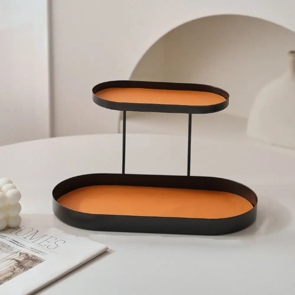 support cosmétiques moderne plateau bijoux flacons parfum crème bougie beige orange noir vert