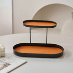 support cosmétiques moderne plateau bijoux flacons parfum crème bougie beige orange noir vert
