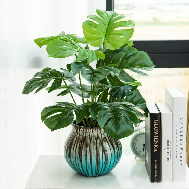 plantes artificielles monstera vert feuilles larges modernes decoration exterieure tronc bois pot ceramique