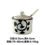 pot condiments porcelaine broyeur épices cuillère fleurs blanches motifs floraux rustique