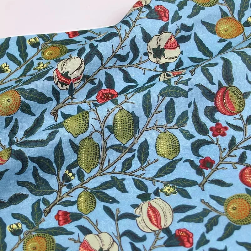 tissu coton imprimé floral motifs fruits pommes citrons couleurs vives noir bleu turquoise orange
