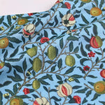 tissu coton imprimé floral motifs fruits pommes citrons couleurs vives noir bleu turquoise orange