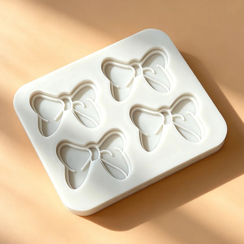 moule silicone nœuds papillons pâtisserie décorative couleurs variées fondant cupcakes