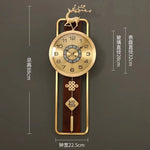 horloge murale chinoise bien être or bois fixation cadran métal motif caractère