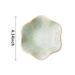 plateau bijoux céramique rose clair blanc bleu foncé motif floral moderne élégant anneaux boucles