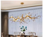 Suspension lumineuse moderne oiseaux transparents branches dorées fleurs blanches led verre chrome poli chambre