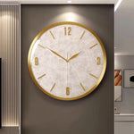 horloge murale moderne or blanc cadran marbré aiguille salon étude