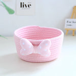 panier rangement rose blanc rayures horizontales noeud décoratif réutilisable polyestère enfantin cordelette organisation jouets