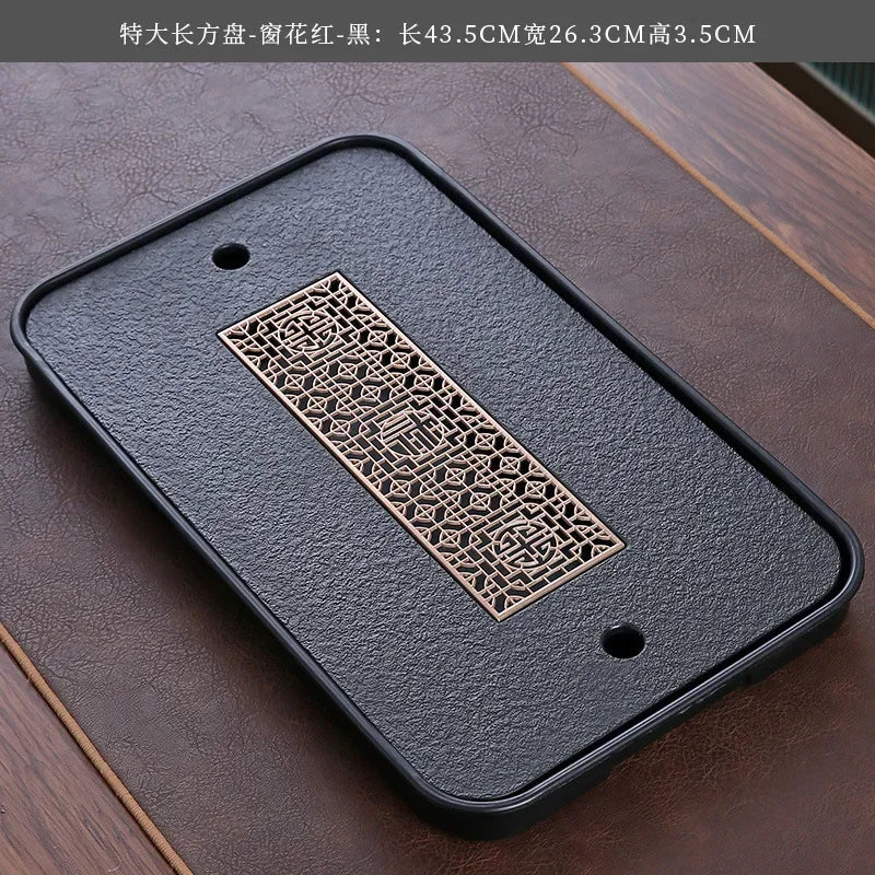 plateau thé noir insert doré traditionnel asiatique service table texture bois clair tasses théière