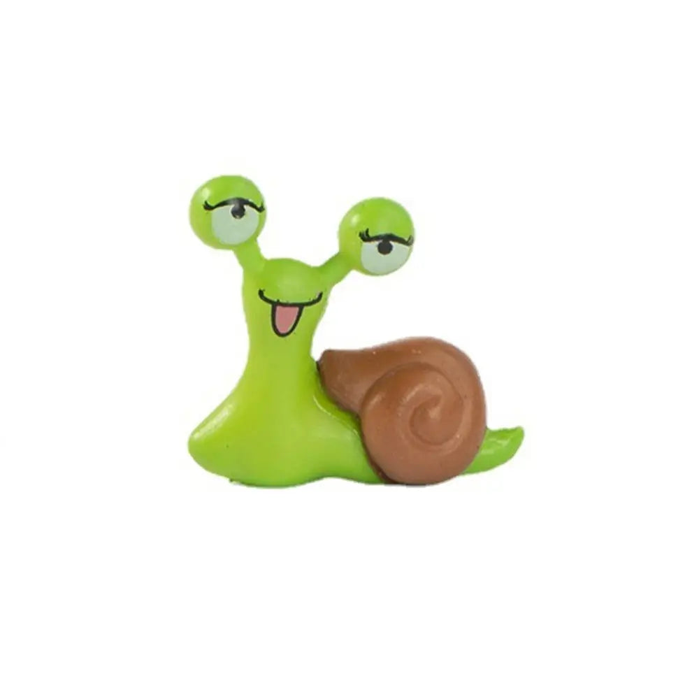 figurines limaces stylisées cartoon vert rose enfantines expressions faciales lisses collection jouets