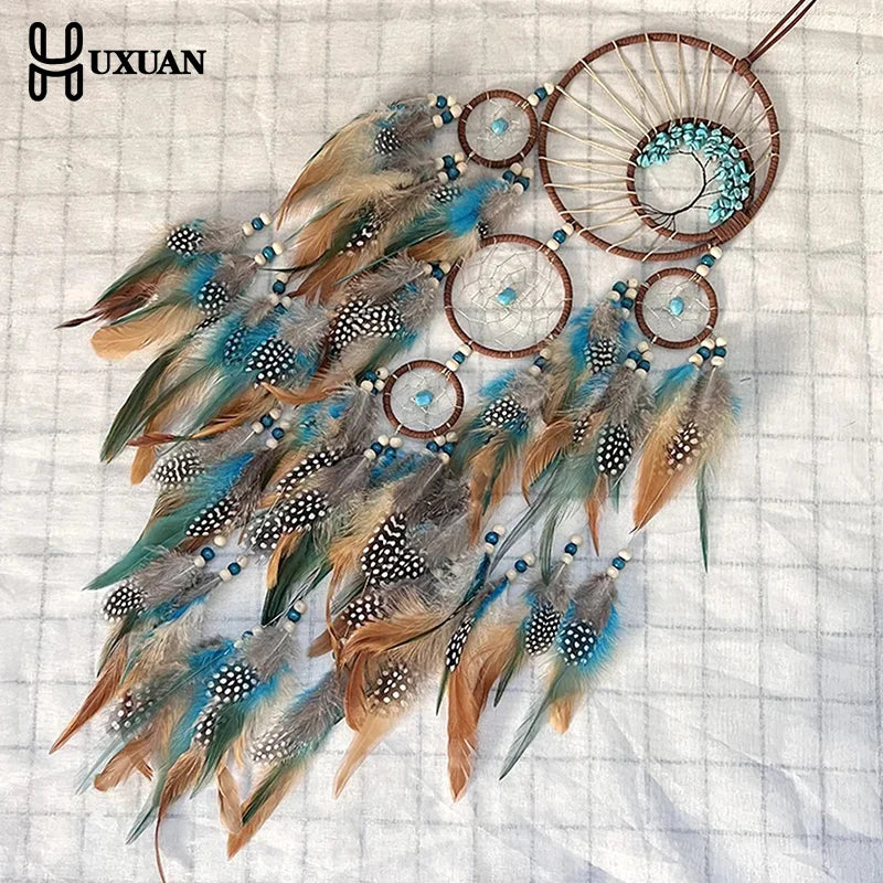 attrape rêves ethnique attrape rêves artisanal plumes bois marron bleu gris blancsuspendu fil