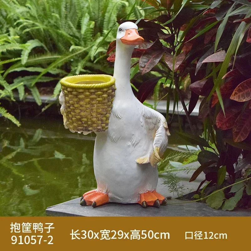 statue canard blanc plumes orange piscine jardin décoration extérieure animaux ornements paysagistes fleurs artificielles
