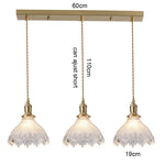 suspension lumineuse vintage vert doré motifs géométriques ampoules câbles chaînes métal
