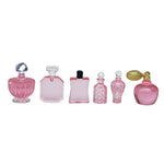 flacons parfum transparents classiques bleu rose capsules dorées