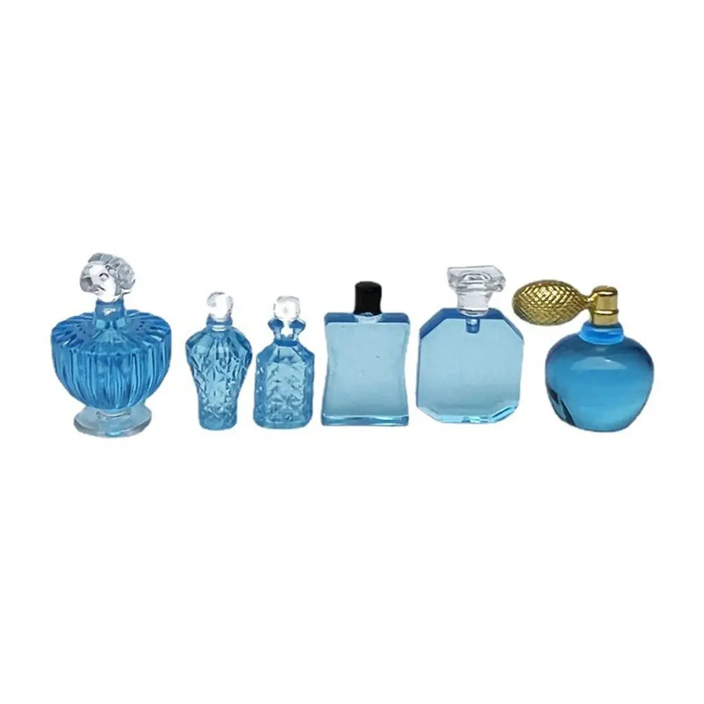 flacons parfum transparents classiques bleu rose capsules dorées