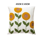 coussins carrés brodés motifs floraux modernes toile blanc jaune vert rouge bleu opaques