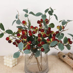 décoration intérieure bouquets branches baies rouges feuilles vertes artificielles naturelles occasion fête maison