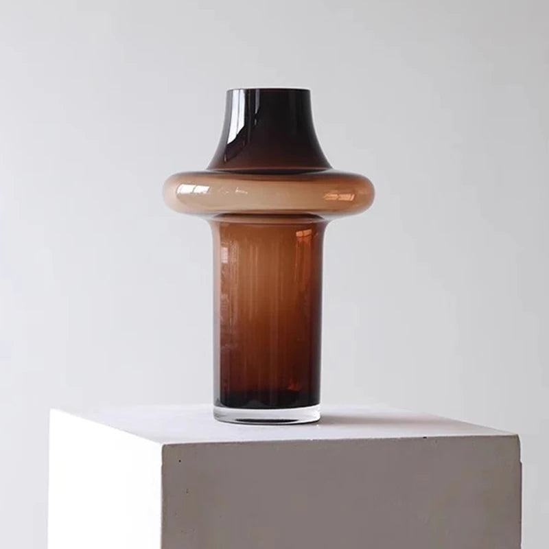 vase verre moderne brun ambré minimaliste plusieurs niveaux branches sèches orchidée bougie cire blanche
