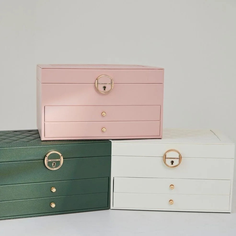 boîte bijoux cuir vert foncé blanc rose pâle motifs géométriques classique chic poignées dorées