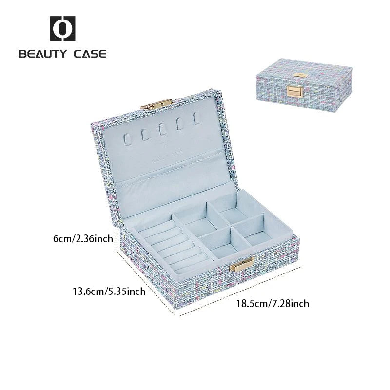 boîte bijoux tissu imprimé bleu clair compartiments poignée dorée classique opacité femmes