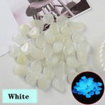 pierres fluorescentes bleu vert jaune rose modernes lisses jardin patio décor lumineux