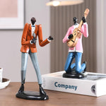 statues miniatures musiciens guitare saxophone trombone batterie décoration intérieure moderne stylisée