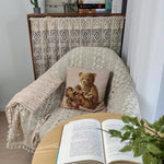 couverture tricotée boho chic beige clair motifs floraux pompons blancs trame rayée usage extérieur