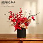 décoration intérieure moderne fleurs artificielles vase noir roses arrondies éléments dorés asiatique