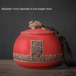 pot thé rouge jaune noir artisanal motifs floraux poisson chaîne pompon hermétique