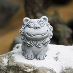 statues lions gris texture sculptée motifs floraux japonais traditionnel shisa dimensions petites