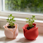 cache pot moderne forme fleur rose clair rose foncé support plante salon table