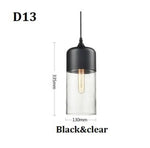 suspension lumineuse moderne pendentif verre noir transparent contemporain fixation câble luminaire salle manger chambre