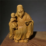 statues sculptées bois naturel artisanal traditionnel trois pièces bébé motifs floraux géométriques maison chambre