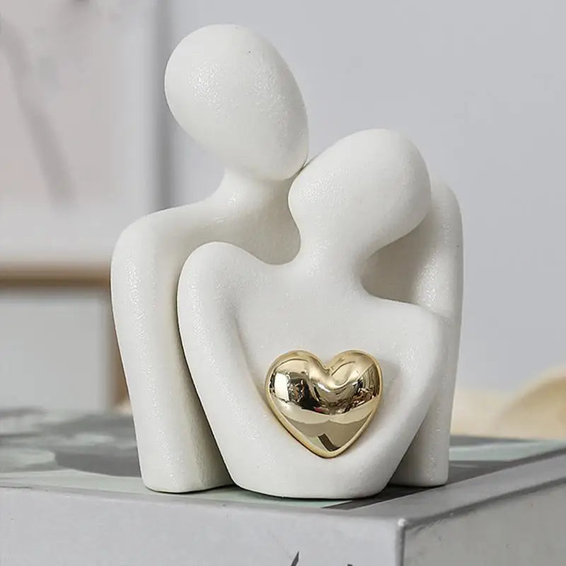 statuette couple stylisé blanc noir cœur doré moderne minimaliste or texturée aspect granuleux