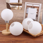 abat jour moderne boule table blanc opac transparent verre base bois câble électrique table